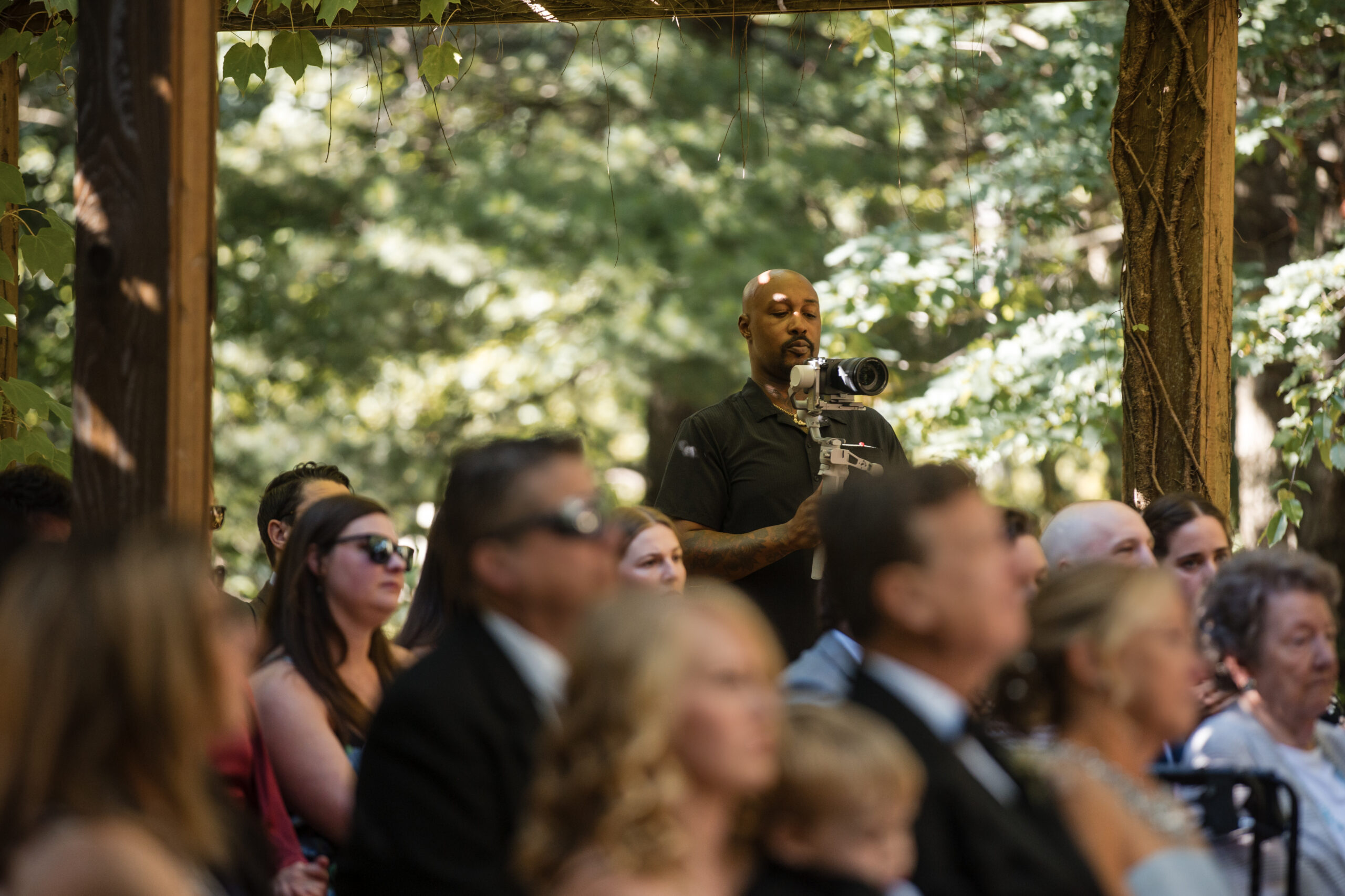 African American wedding videographer filming couple at Detroit ceremony – Sivad Media Group
